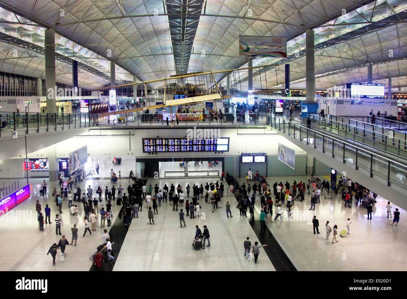 Passengers in the airport main lobby on April 26, 2014 in Hong Kong, China. The Hong Kong airport handles more than 70 million p Stock Photo