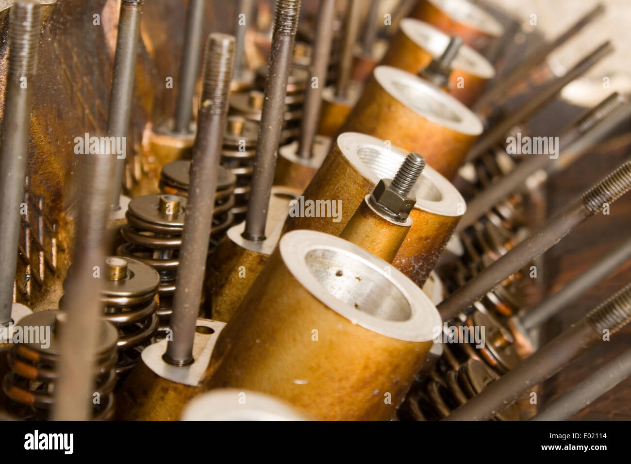 A close up of a head off a internal combustion engine including valve springs Stock Photo