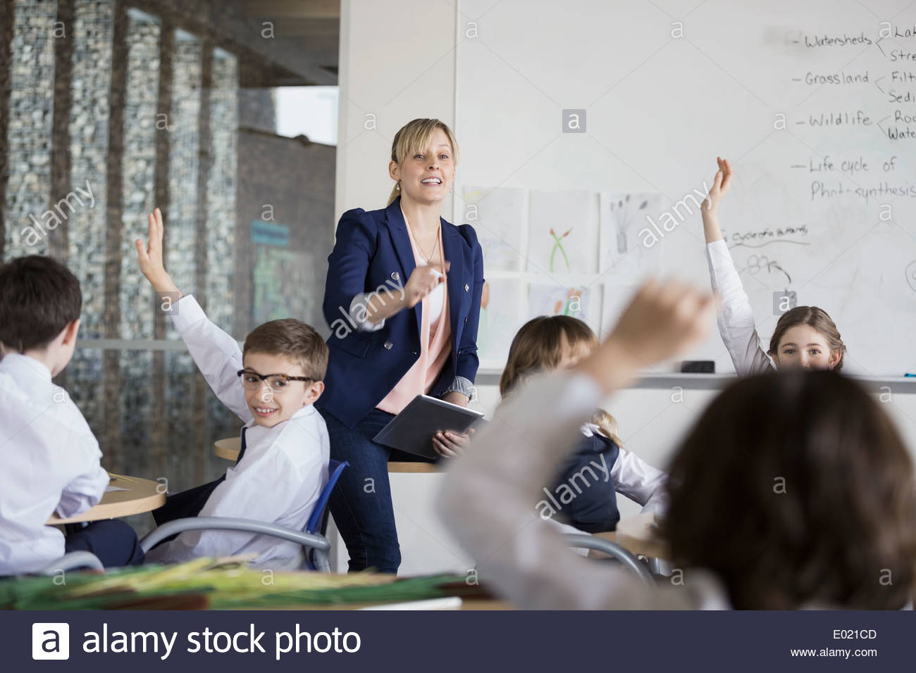 Teacher holding book classroom hi-res stock photography and images - Alamy