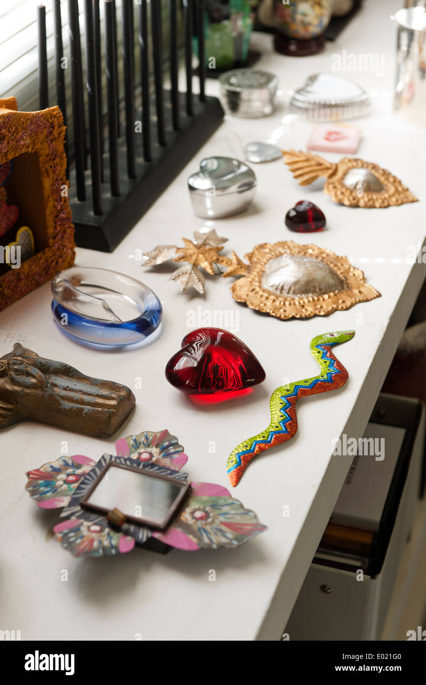 Collected items on side table of Baja home Stock Photo