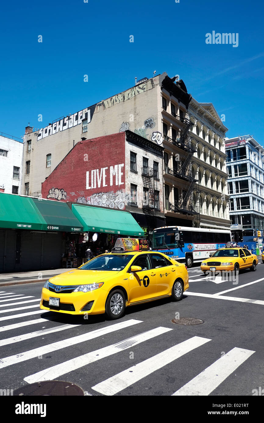 Iconic New York City taxi cabs wait at an intersection in Manhattan. Stock Photo