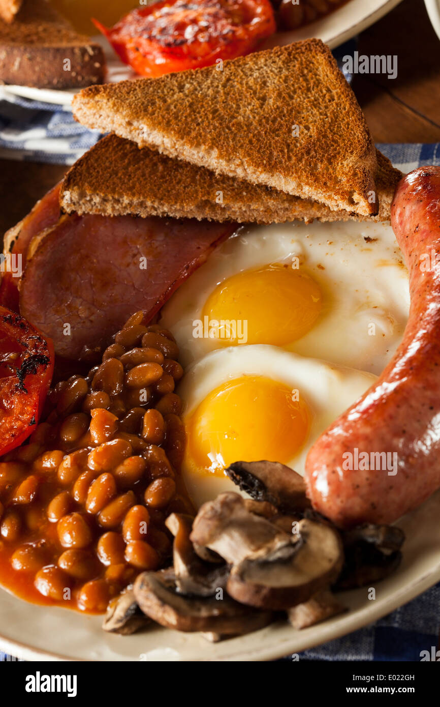 Traditional Full English Breakfast with Eggs, Bacon, Sausage, and Baked