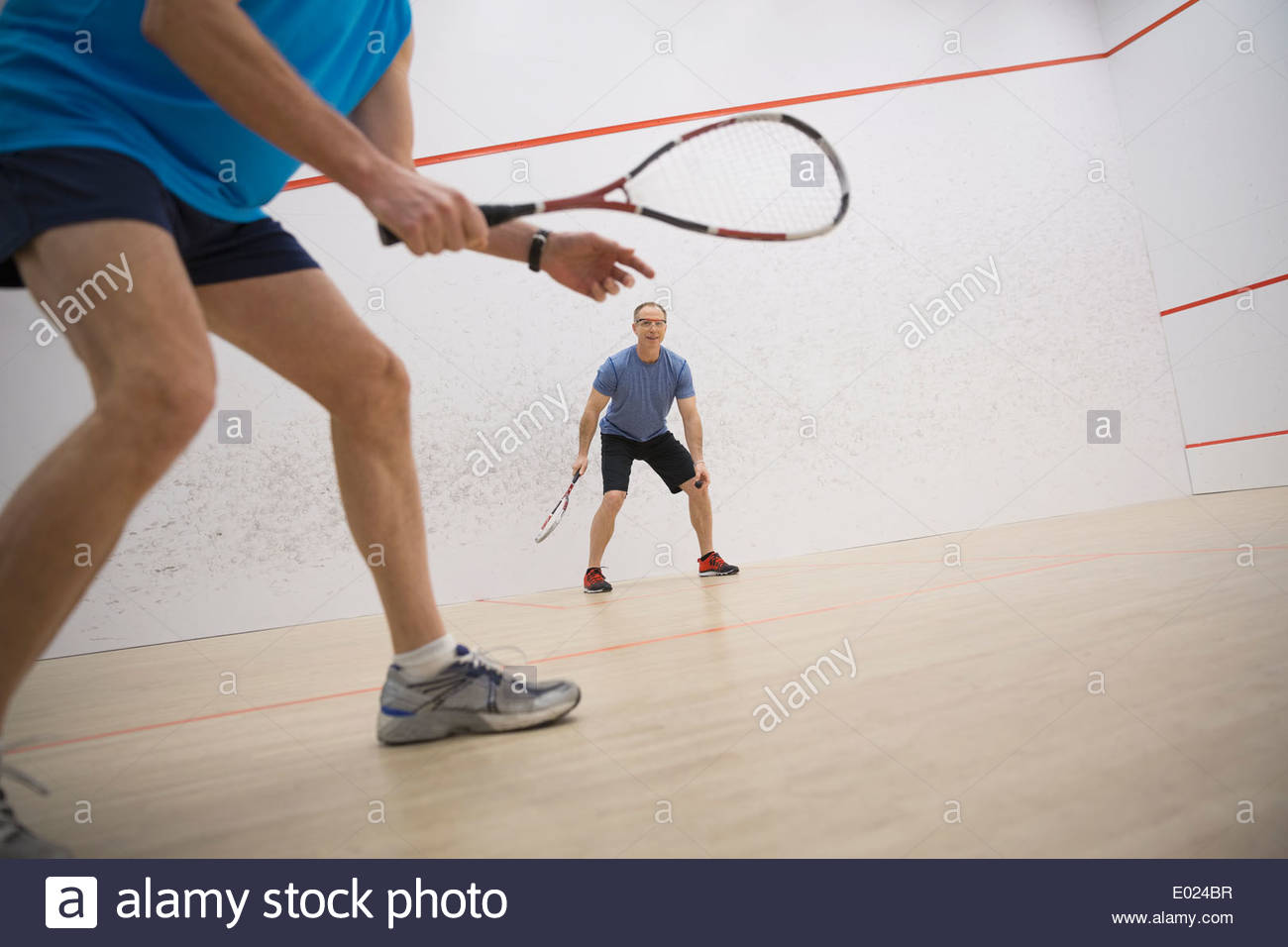 Men playing squash on court Stock Photo Alamy