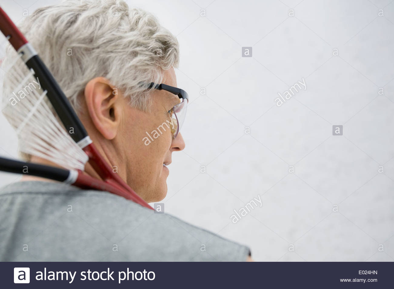 Man in goggles holding squash racket Stock Photo Alamy