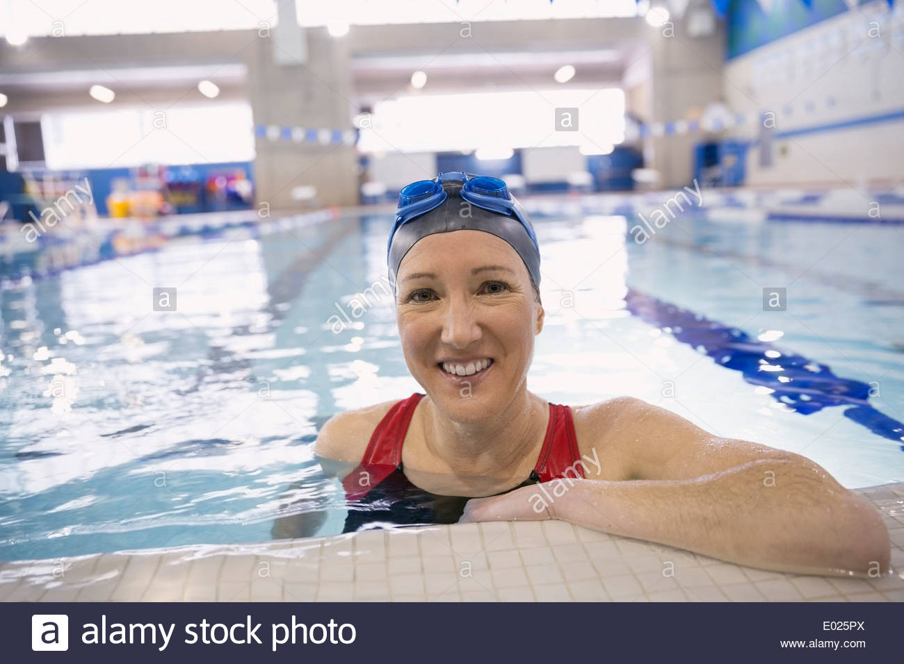 Woman Leaning On Edge Of Swimming Pool Hi Res Stock Photography And