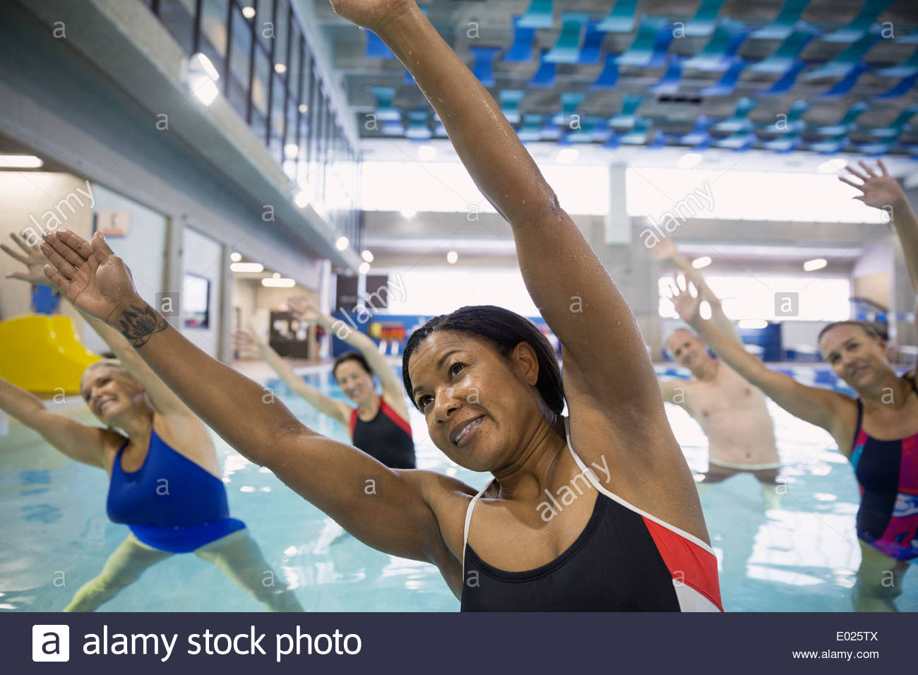 Water aerobics class at indoor swimming pool Stock Photo