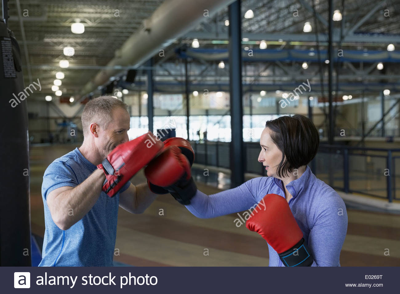 Woman boxing with personal trainer Stock Photo