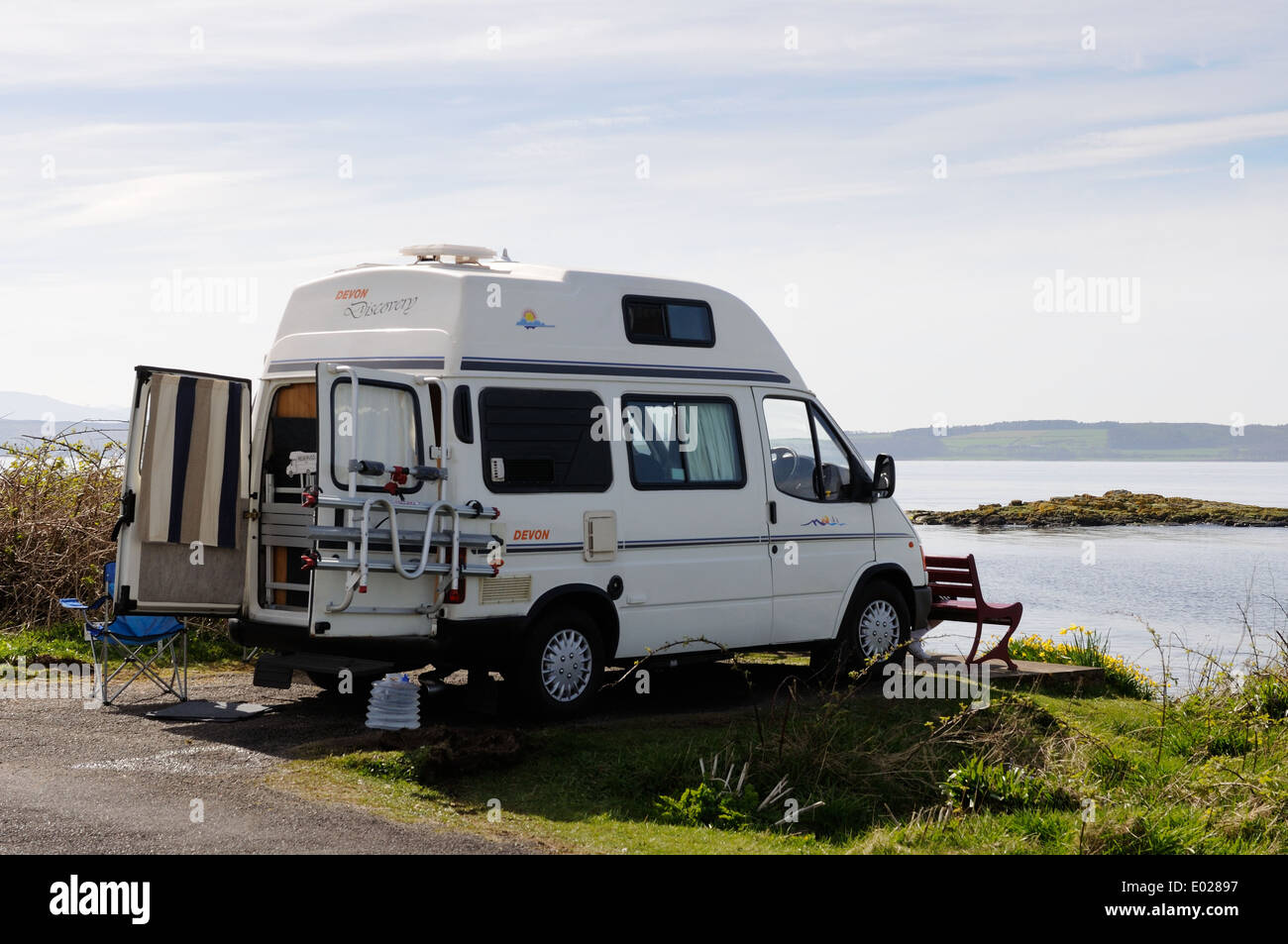 Mobile home parked up and overlooking the Clyde estuary from the Isle of Cumbrae Stock Photo