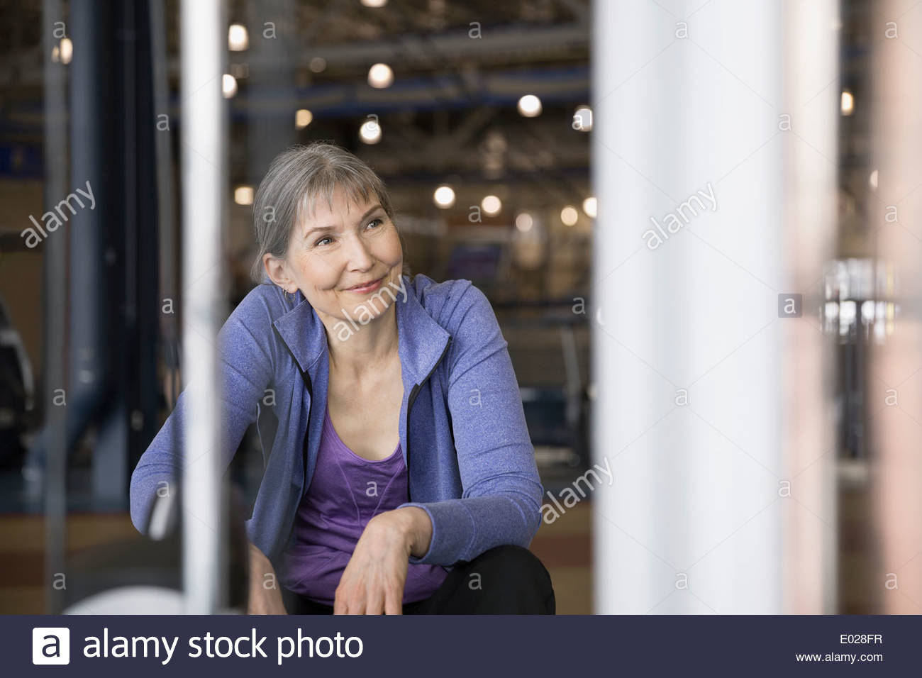 Smiling woman at gym Stock Photo