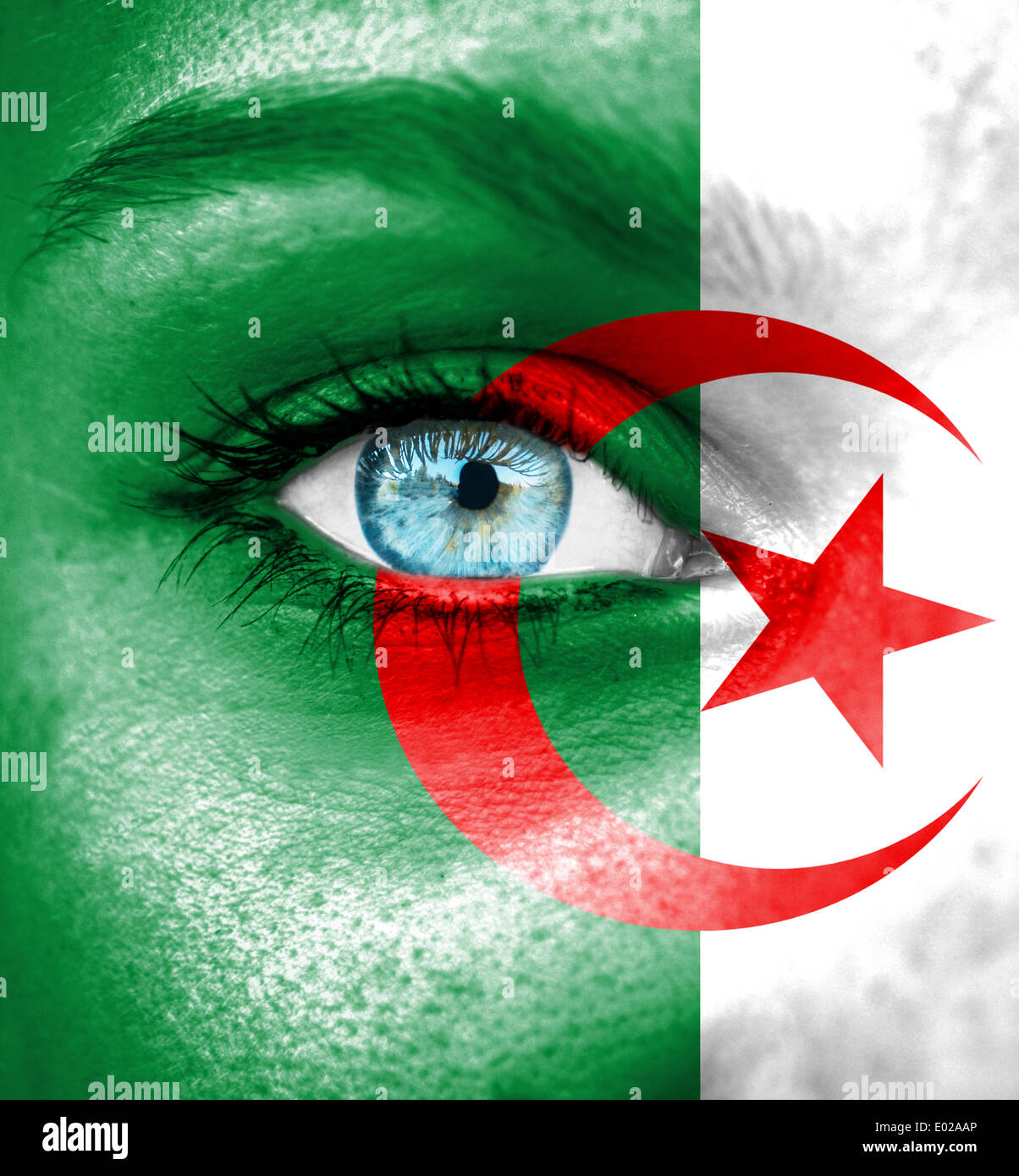 Woman face painted with flag of Algeria Stock Photo