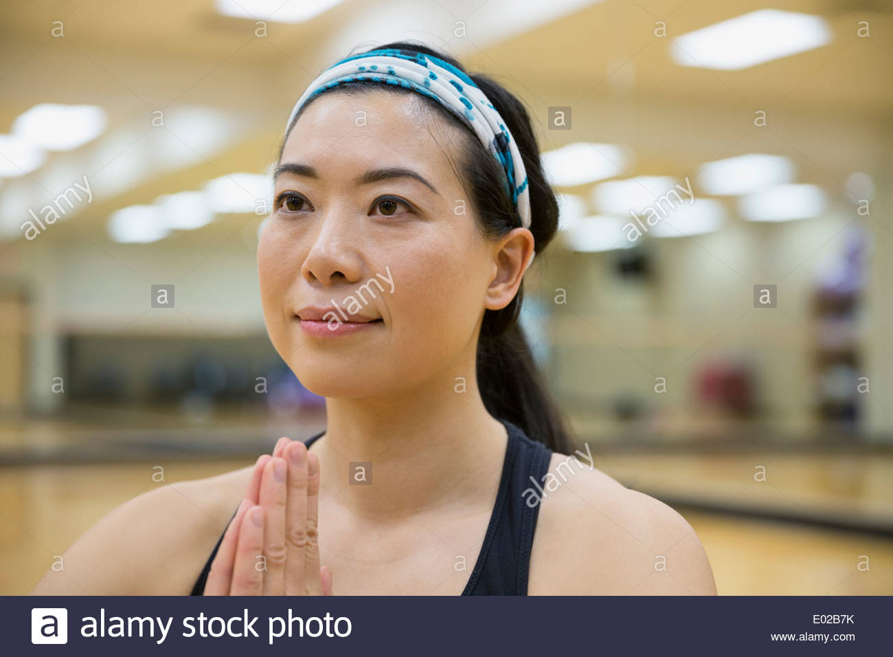Close up of woman in yoga prayer position Stock Photo