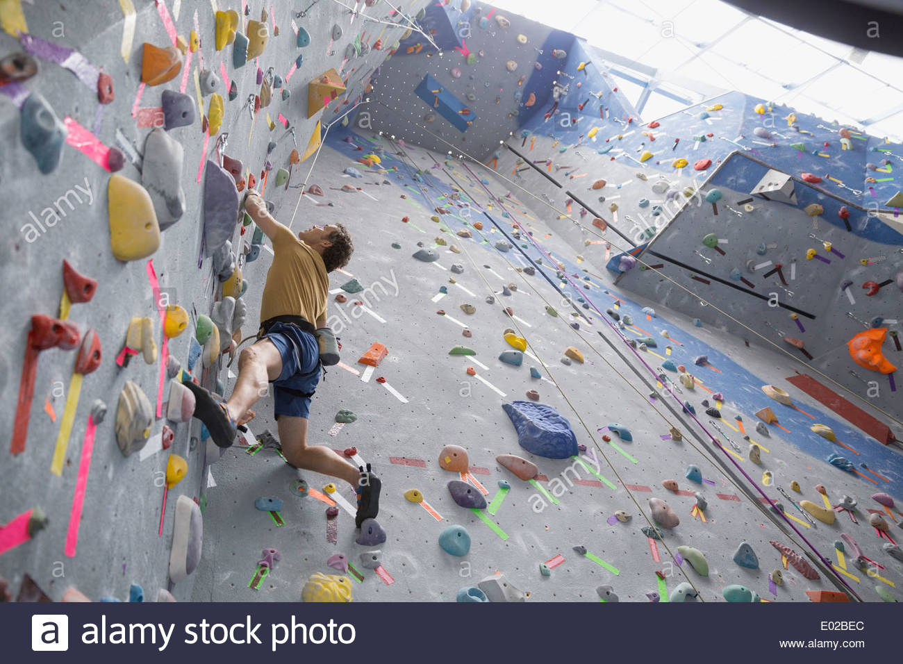 Man climbing indoor wall hi-res stock photography and images - Alamy
