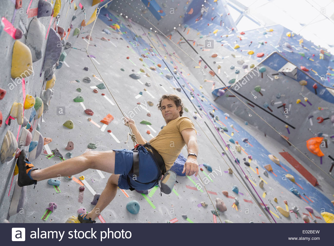 Man climbing indoor wall hi-res stock photography and images - Alamy