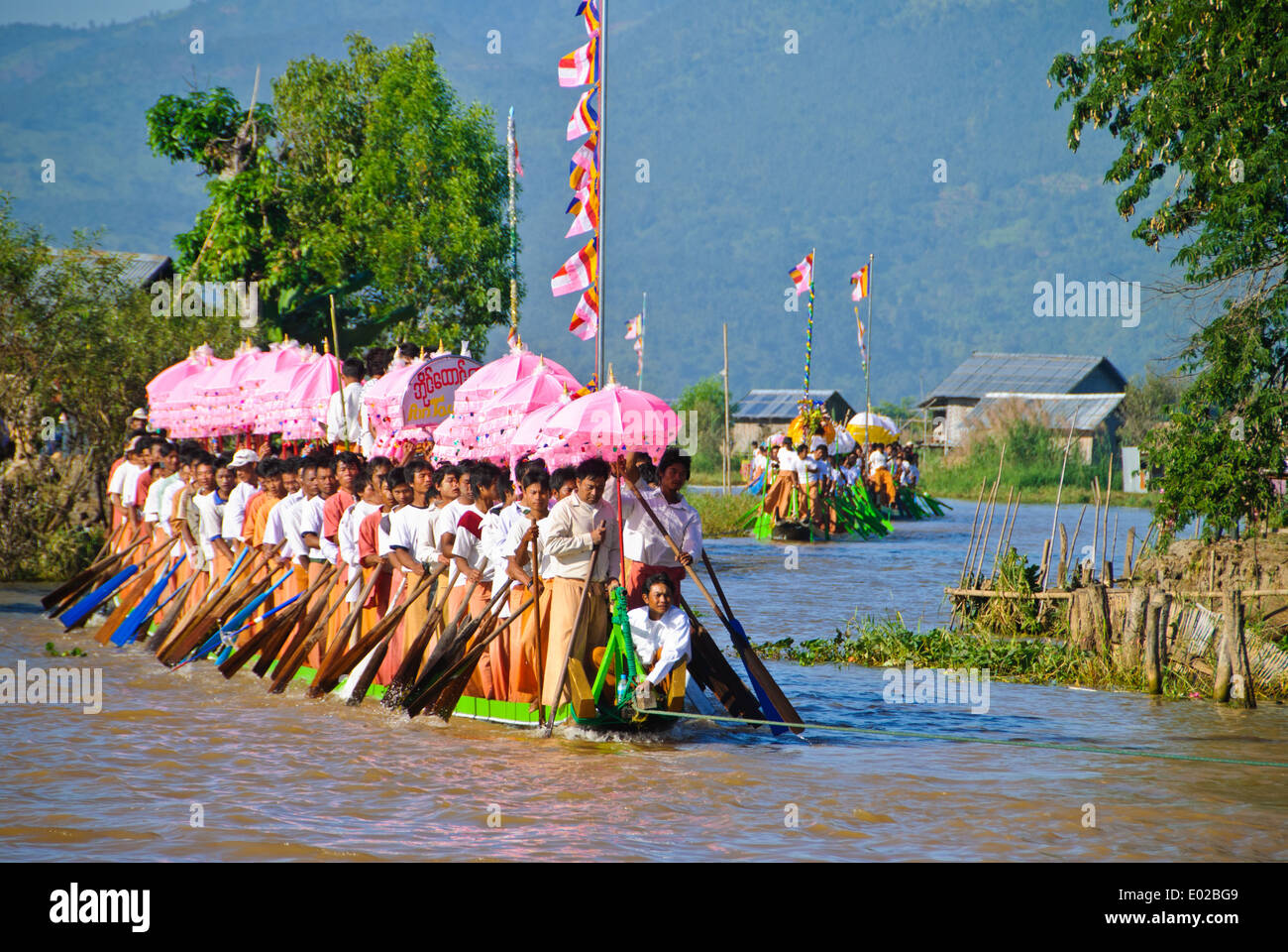 The water procession coming into Nyaung Shwe village, Inle Lake Festival Stock Photo