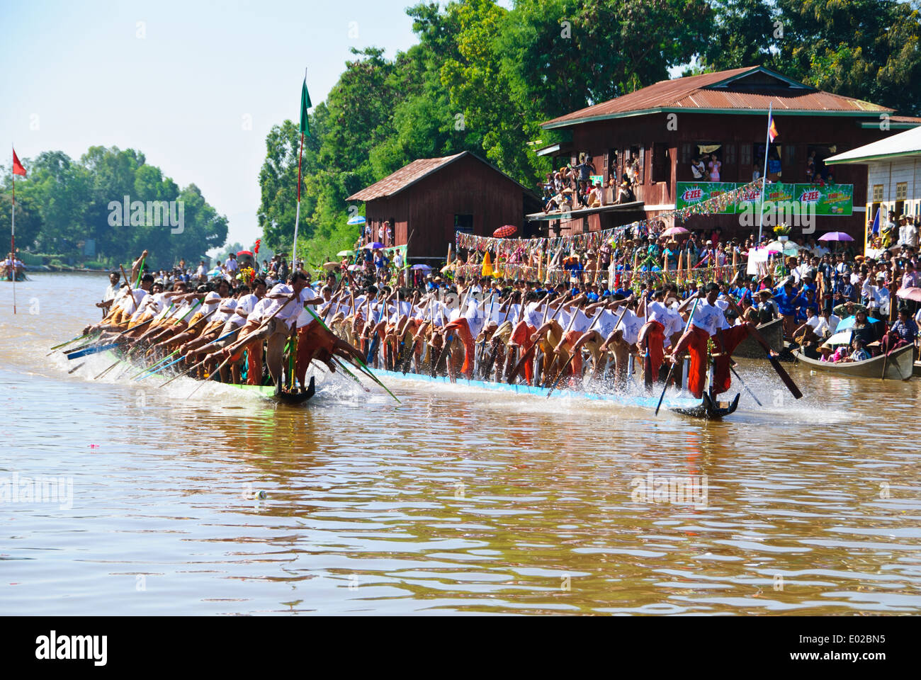 Leg-rowing boat racing during the Inle Lake Festival at Nyaung Shwe. Stock Photo