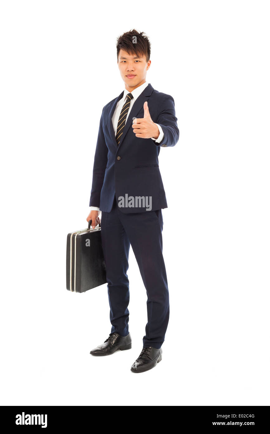 young businessman holding a briefcase and thumb up Stock Photo