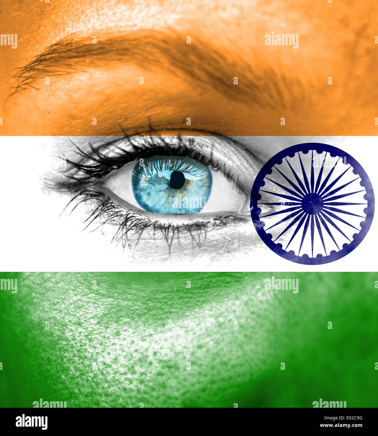 Woman face painted with flag of India Stock Photo
