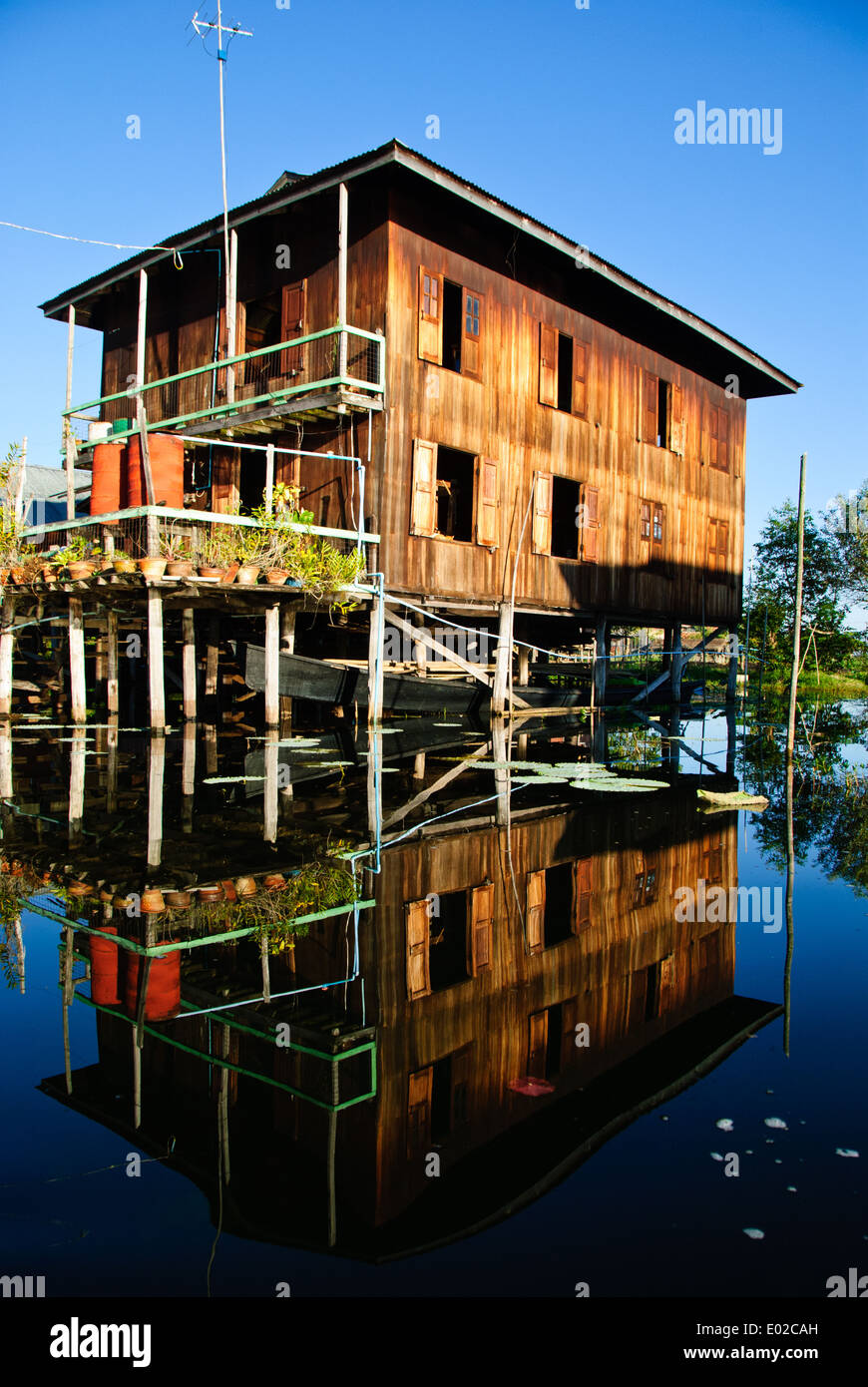 A wooden house built on stilts over the lake of Inle. Stock Photo