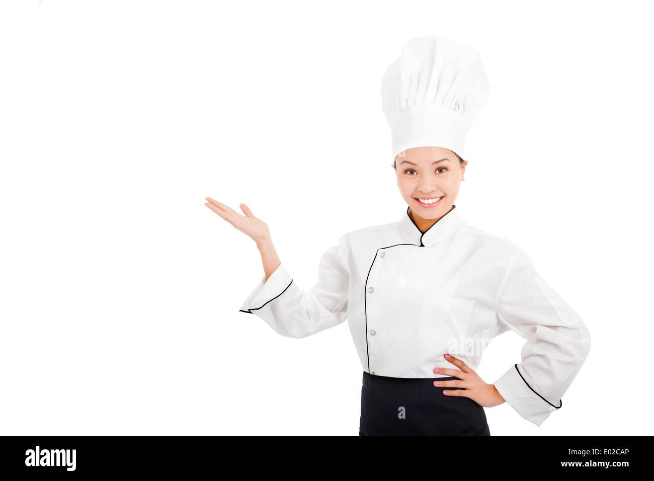 professional female cook raise hands to show something Stock Photo