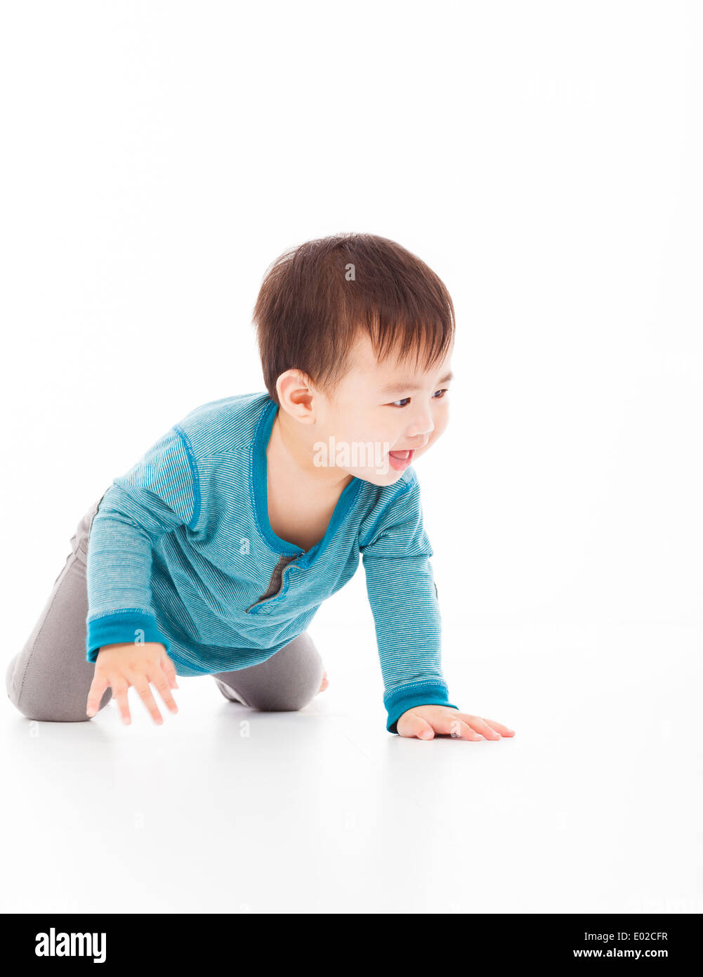 cute baby boy is crawling on floor Stock Photo
