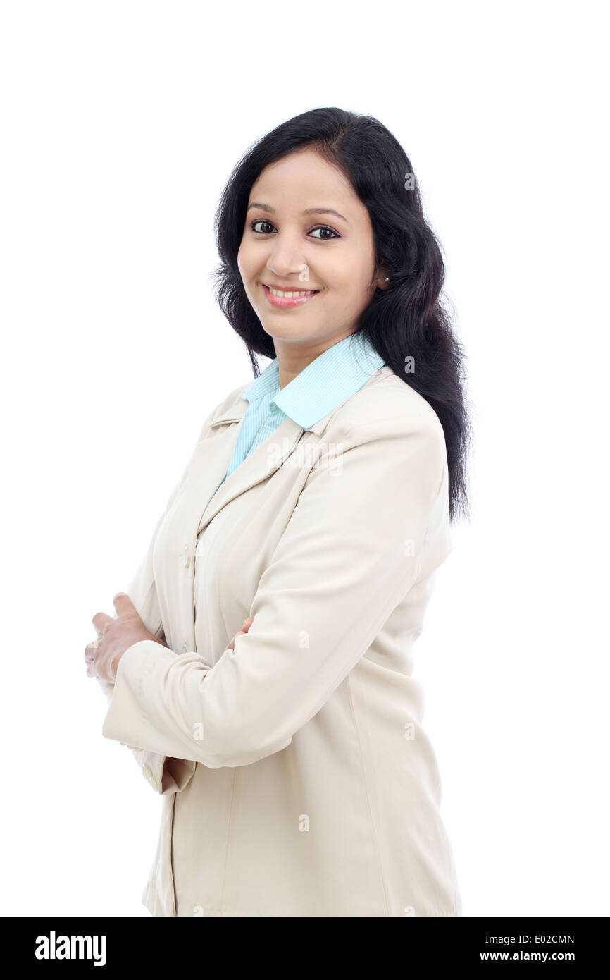 Young Indian business woman with arms crossed against white Stock Photo ...