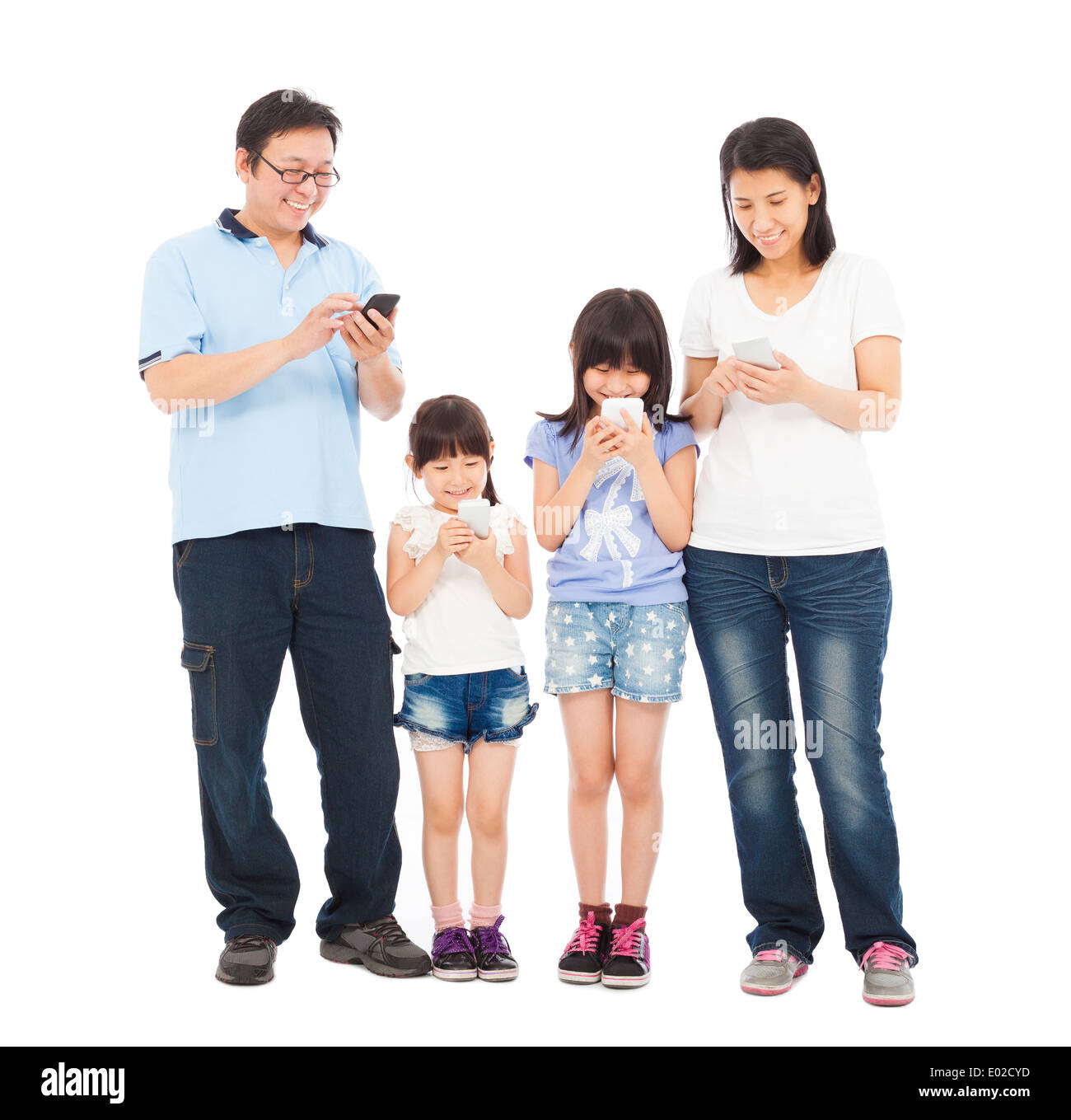Family standing a row and using smart phone together Stock Photo
