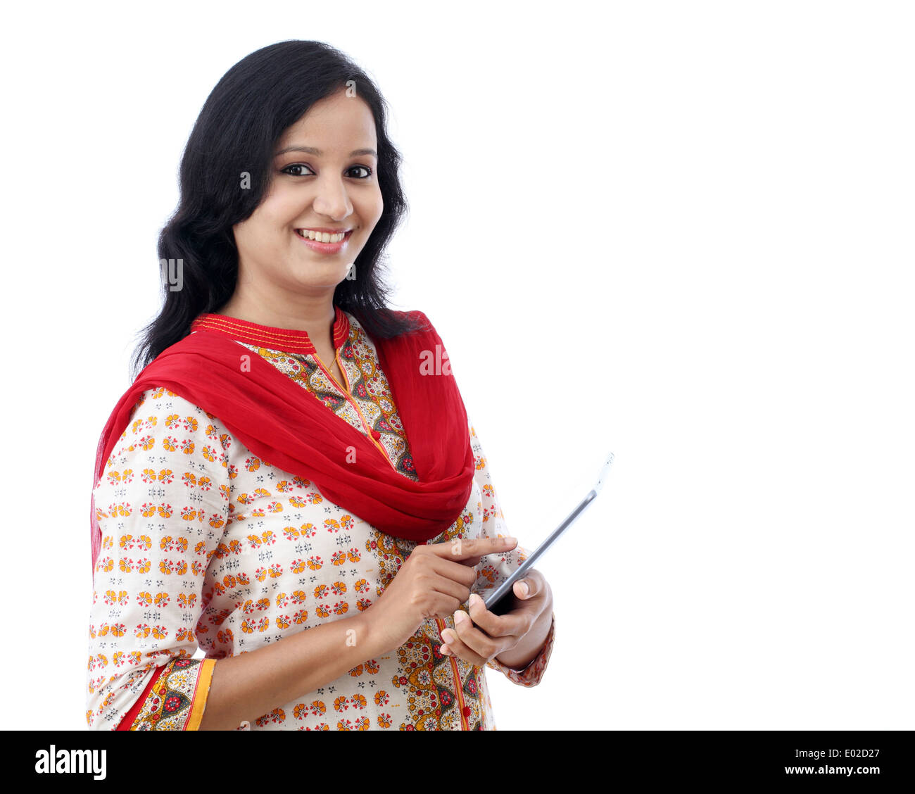 Happy young woman with tablet against white background Stock Photo
