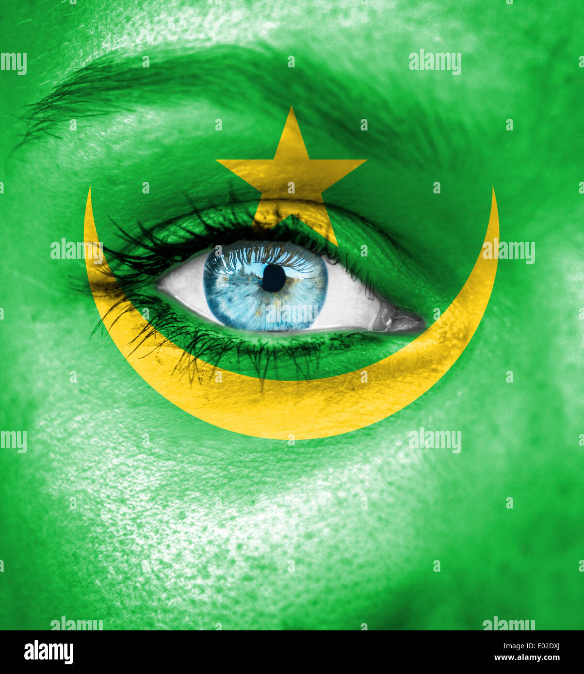 Woman face painted with flag of Mauritania Stock Photo