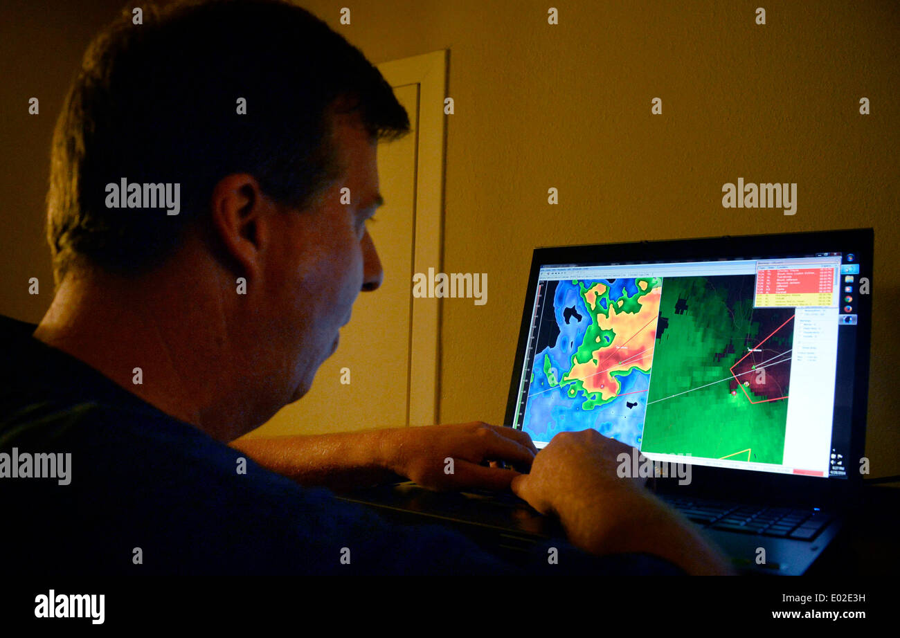 April 27, 2014. Tuscaloosa Alabama. USA-Storm chaser Brad Mack points out a TVS( Tornadic vortex signature) tornado storm on the radar going over his hotel in Tuscaloosa Alabama Monday night April 28, 2014. Dozens of tornadoes flared up across the south inflicting widespread damage across Alabama and Mississippi that contributed to the deaths of more than a dozen individuals. Preliminary reports from the National Weather's Storm Prediction Center indicate 52 reports of tornadoes since 7 am CDT Monday.At least seven people were killed in Mississippi from the wave of tornadoes that scarred the Stock Photo