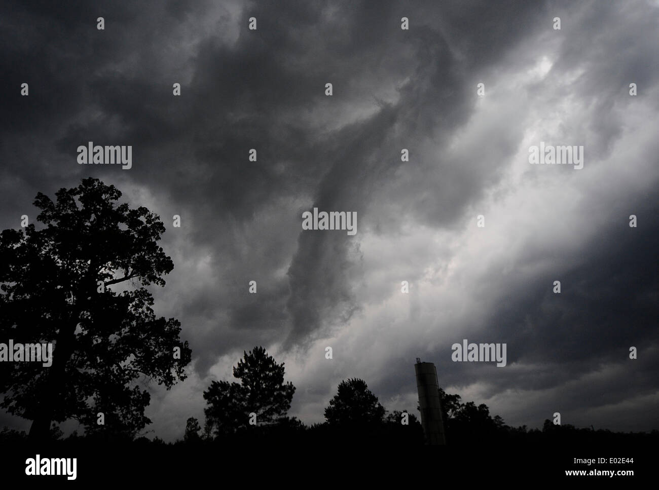 Louisville, Mississippi, USA. 28th April, 2014.  A funnel cloud is seen crossing the town of Louisville Mississippi Monday. Dozens of tornadoes flared up across the south inflicting widespread damage across Alabama and Mississippi that contributed to the deaths of more than a dozen individuals. Preliminary reports from the National Weather's Storm Prediction Center indicate 52 reports of tornadoes since 7 am CDT Monday. Credit:  ZUMA Press, Inc./Alamy Live News Stock Photo