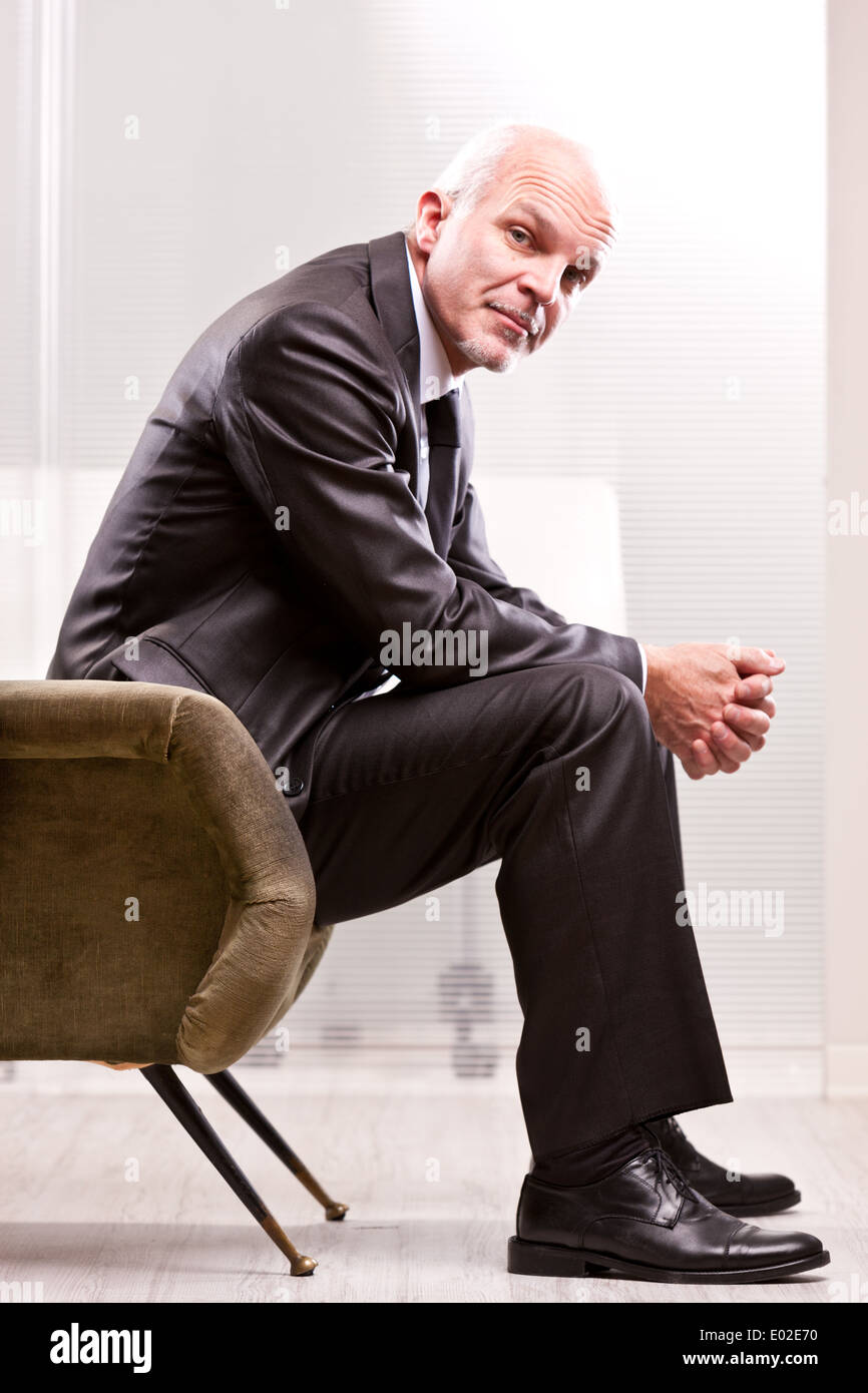 mature businessman looking at you with a strong empathy Stock Photo
