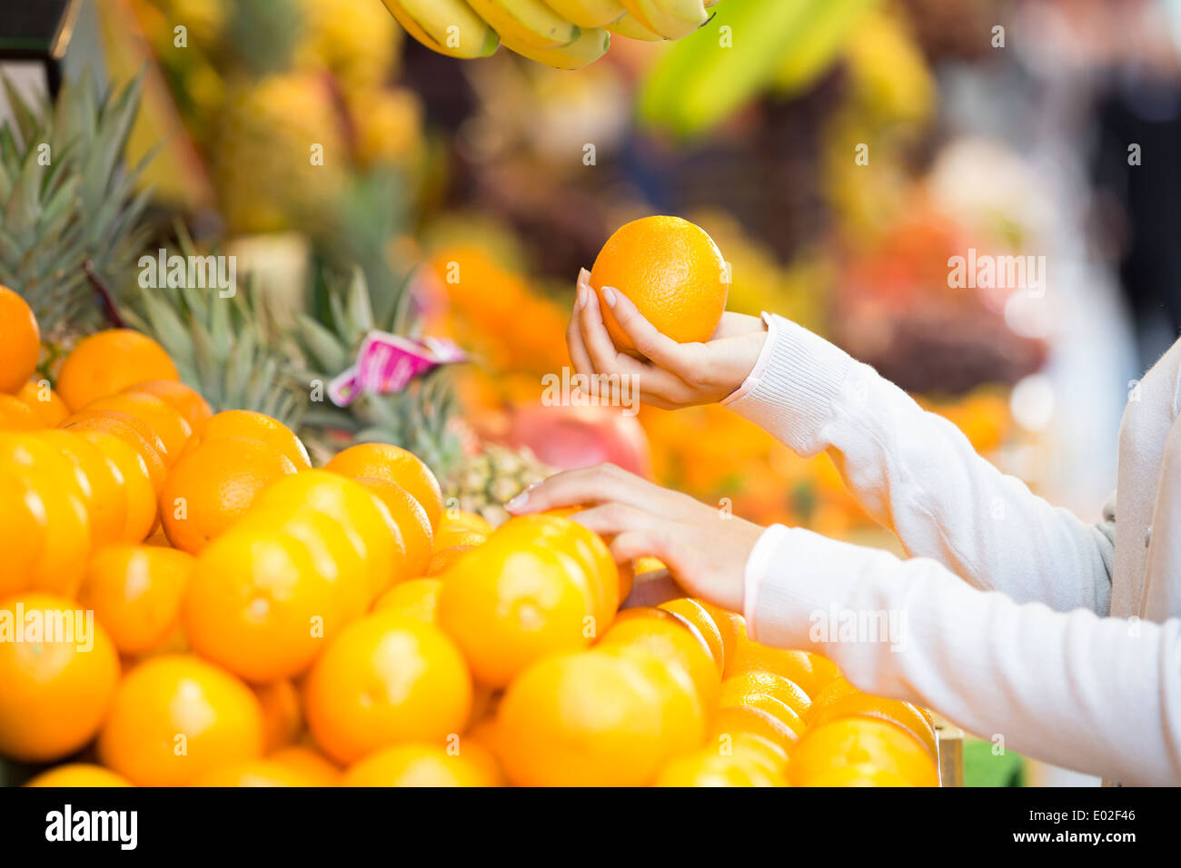 Female close-up hand apple orange Stock Photo