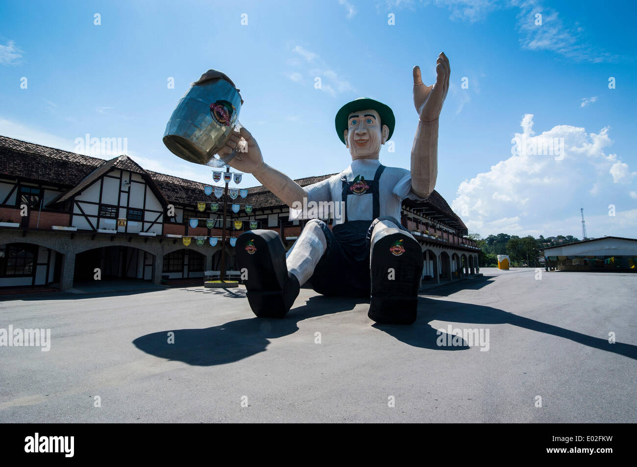 Huge inflatable doll wearing traditional Bavarian dress, in front of the Schützenhalle hall, Jaraguá do Sul, Santa Catarina Stock Photo