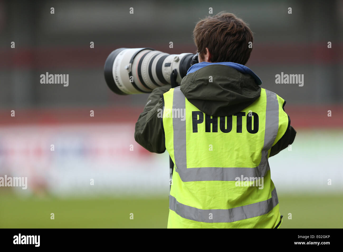 Sports photographer with 400mm Canon Super Telephoto Lens Stock Photo