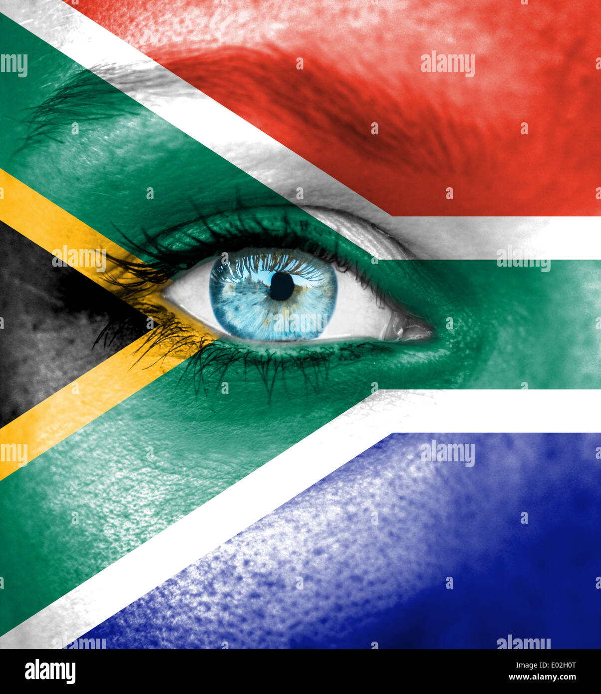 Woman face painted with flag of South Africa Stock Photo