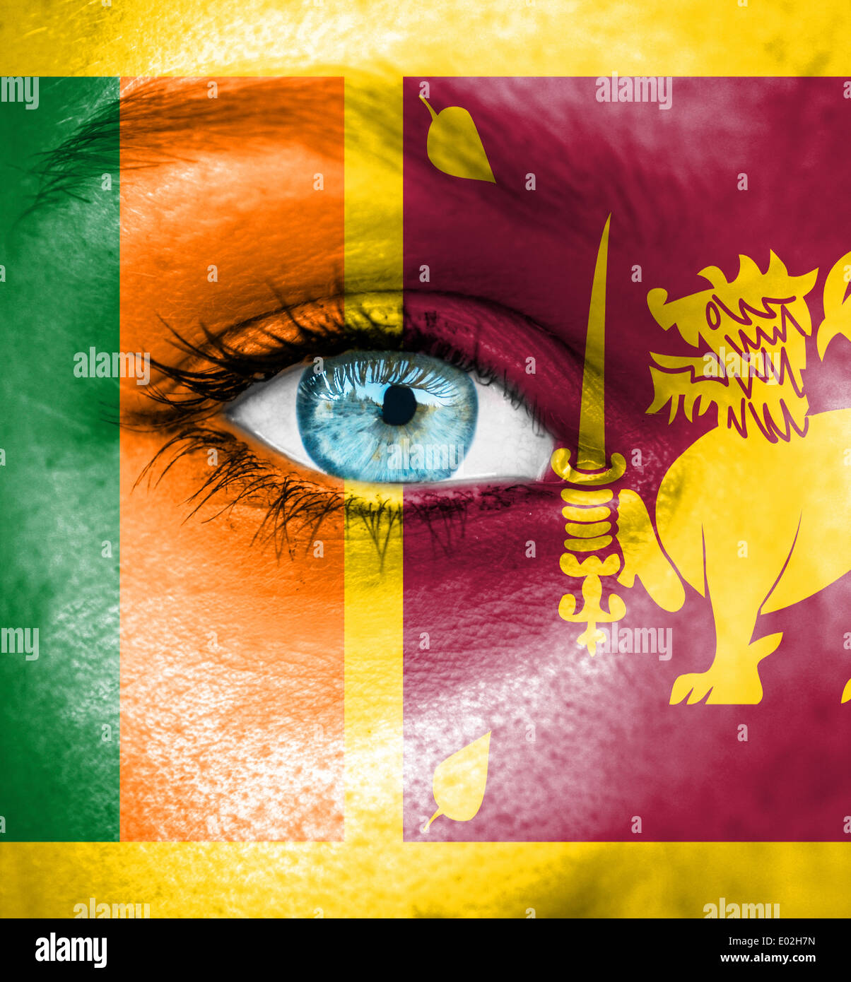 Woman face painted with flag of Sri Lanka Stock Photo