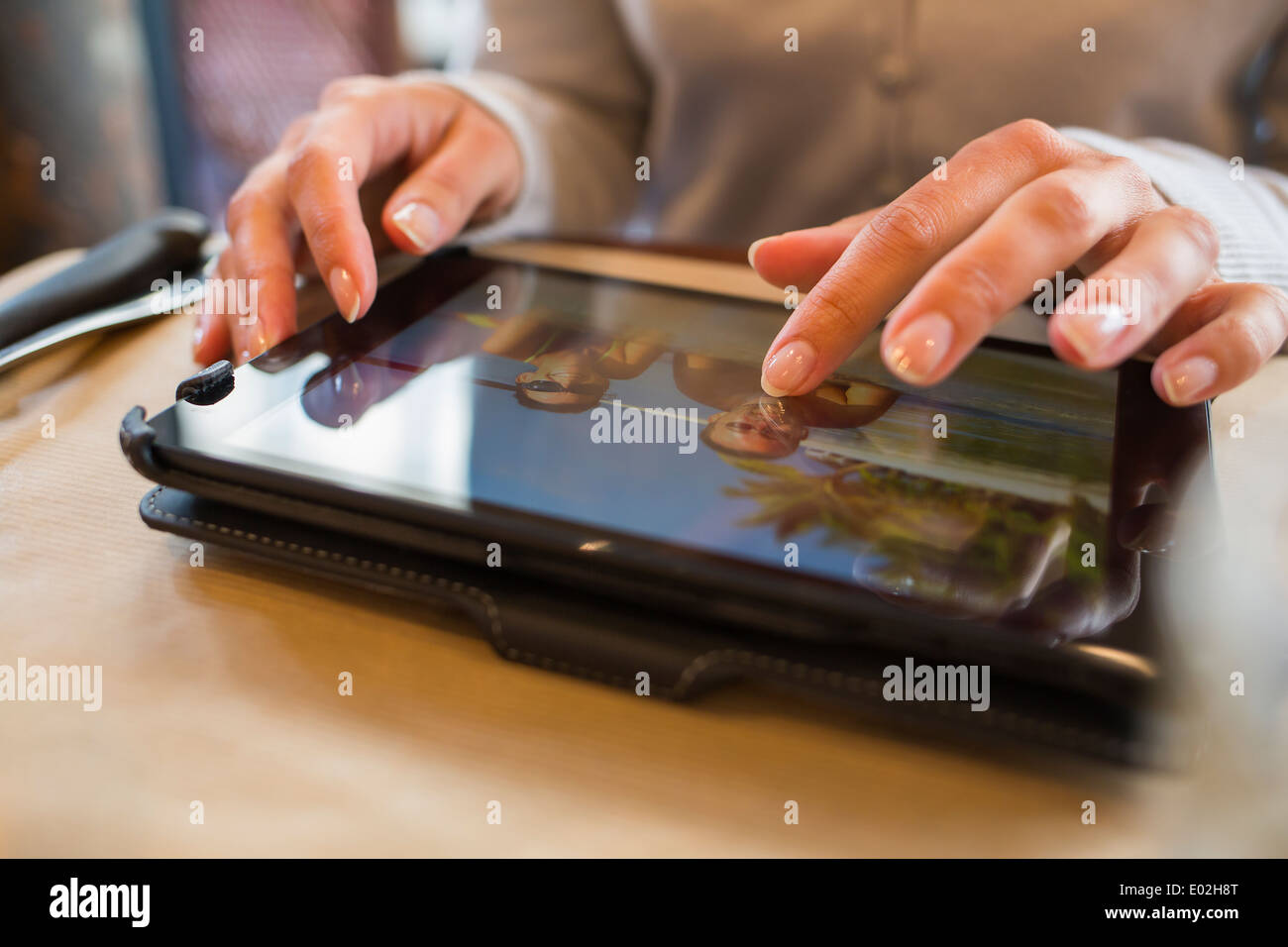 Female digital tablet computer bar restaurant Stock Photo