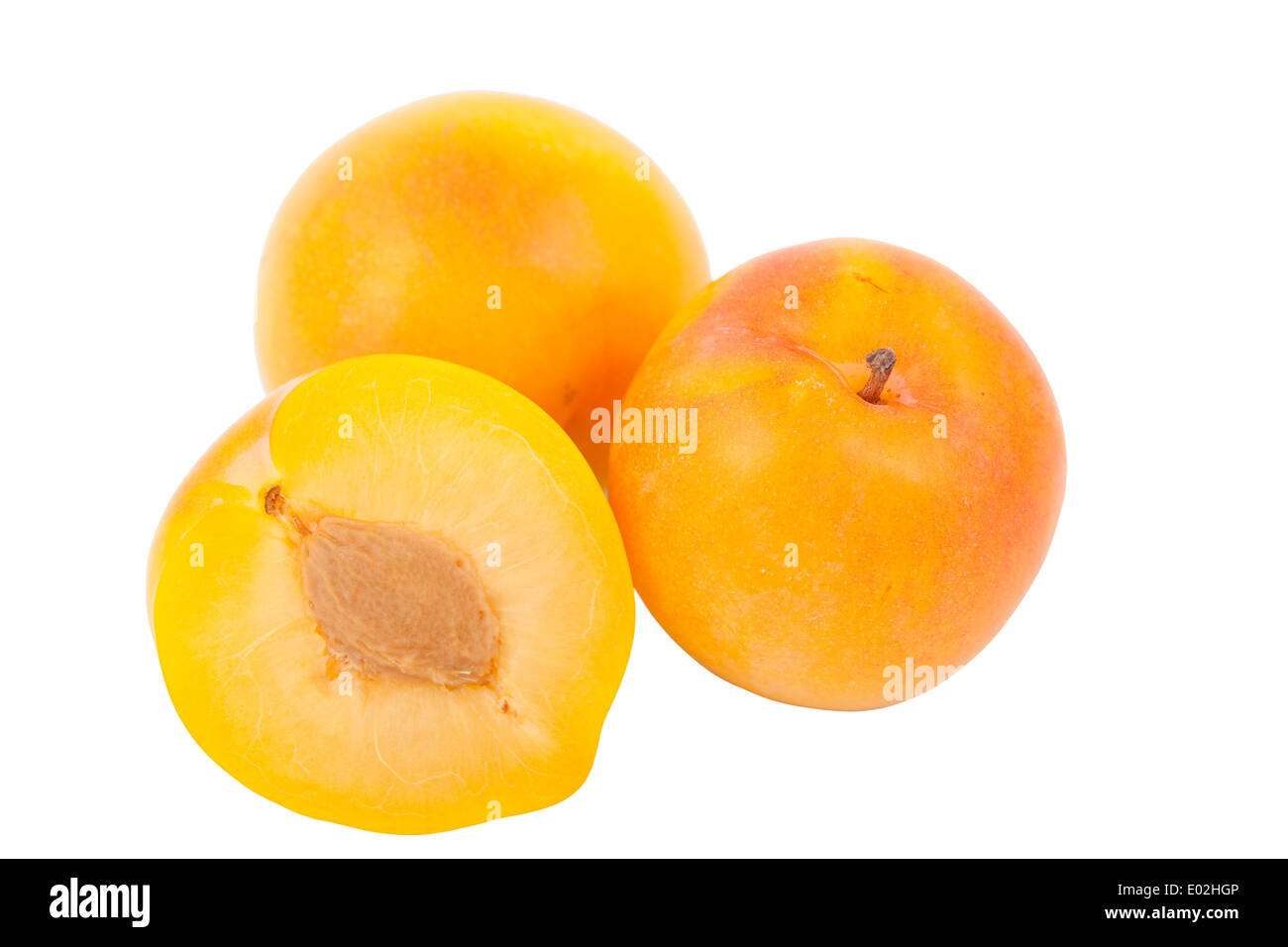 two whole yellow plum on white background Stock Photo