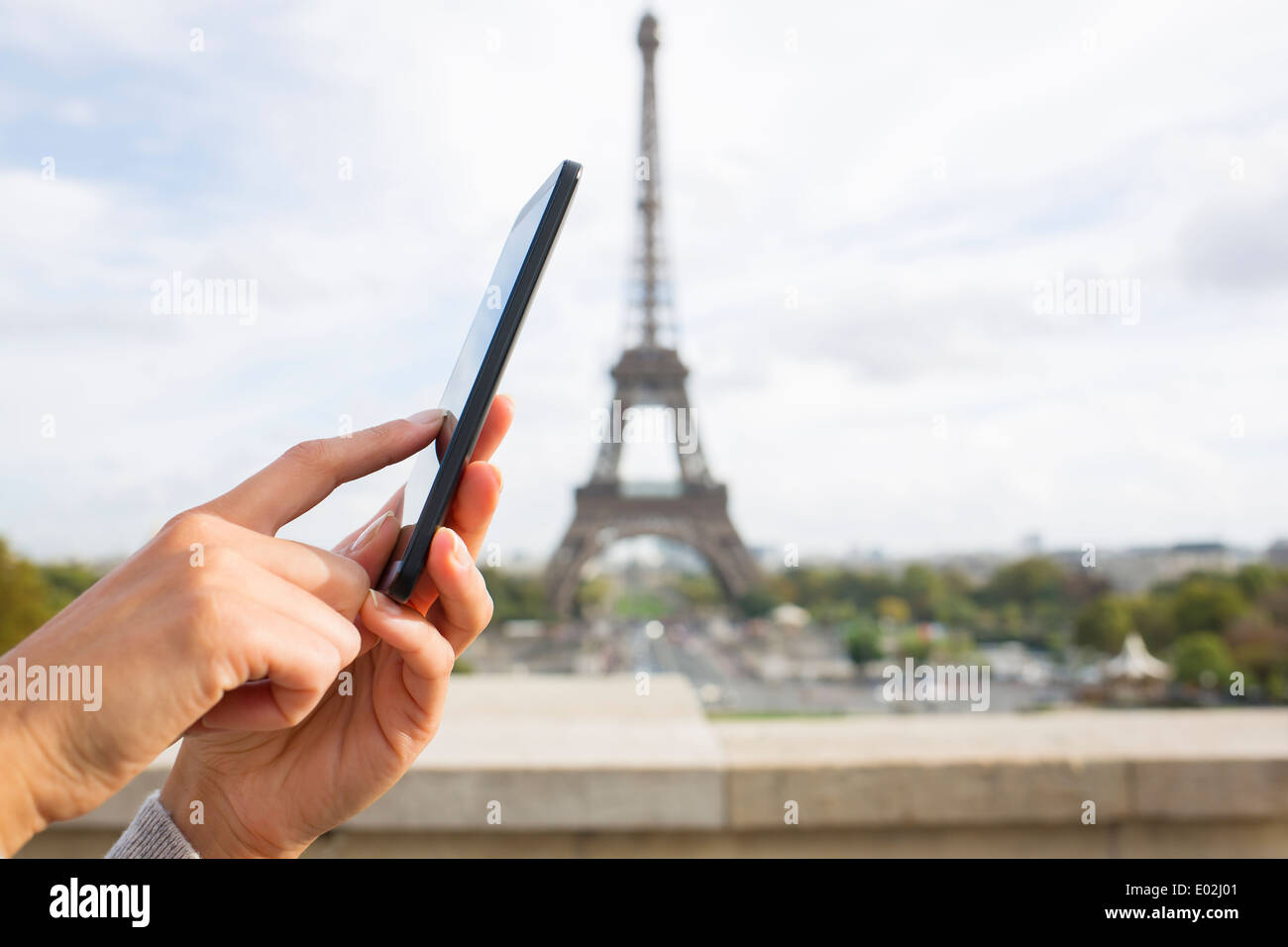Close up of hands Female mobile phone Paris message sms e-mail Stock Photo