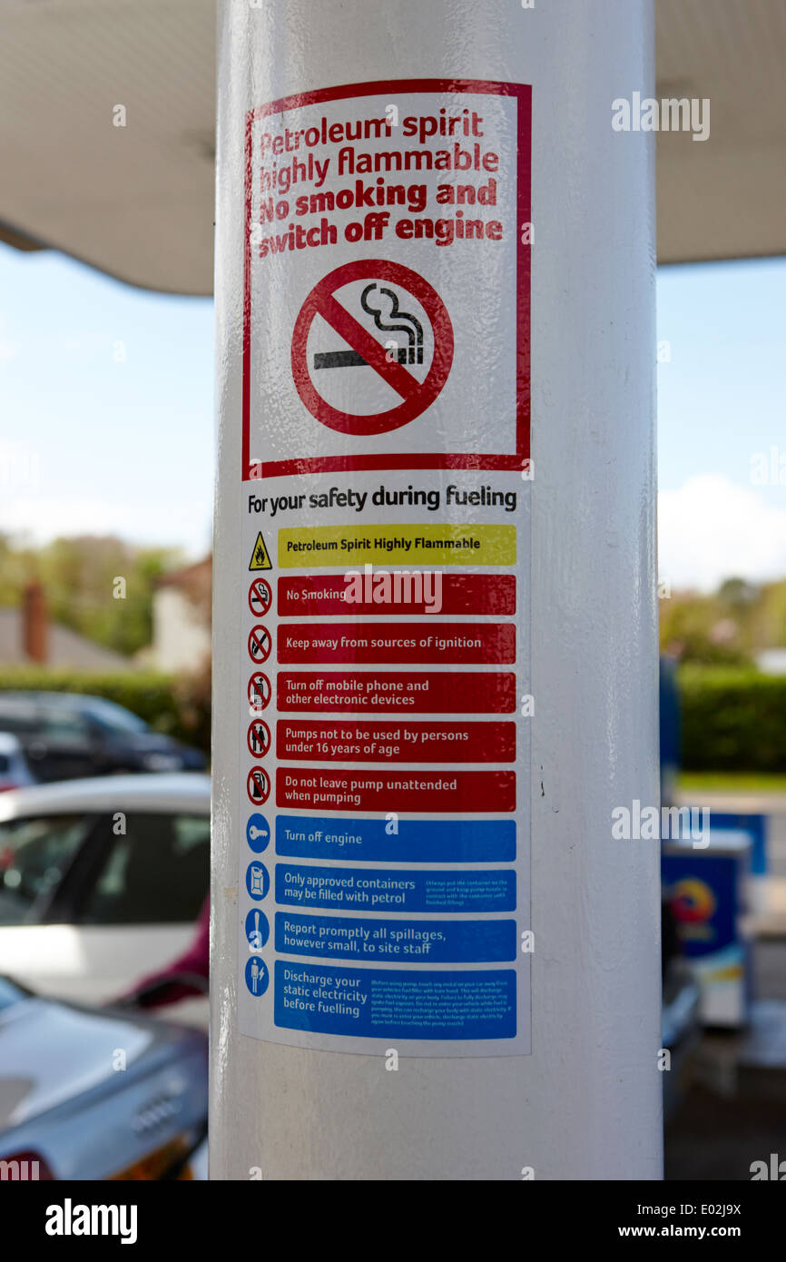 petrol station forecourt warning hazard signs no smoking health safety northern ireland Stock Photo