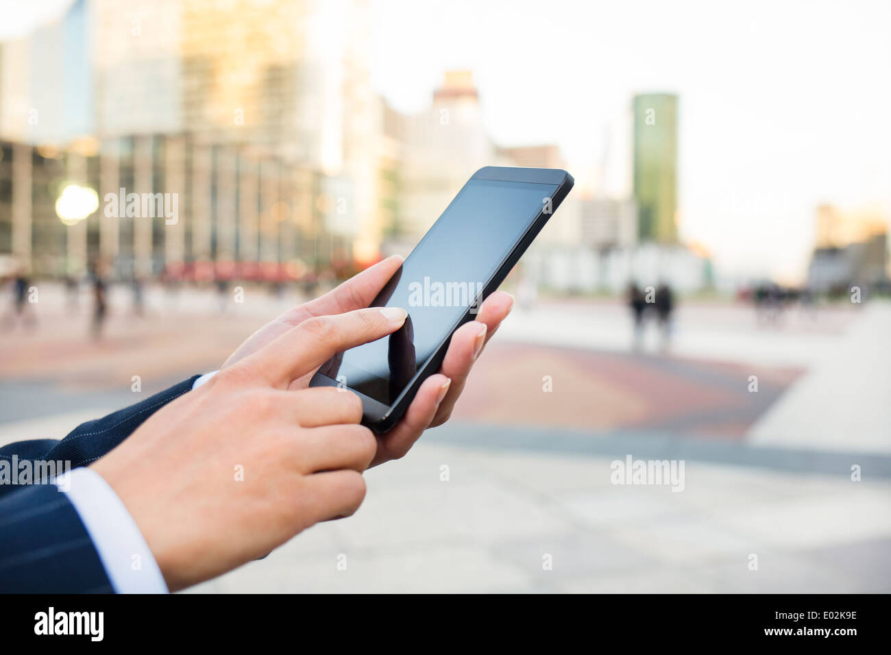 Female Mobile phone hand outdoor message sms e-mail Stock Photo