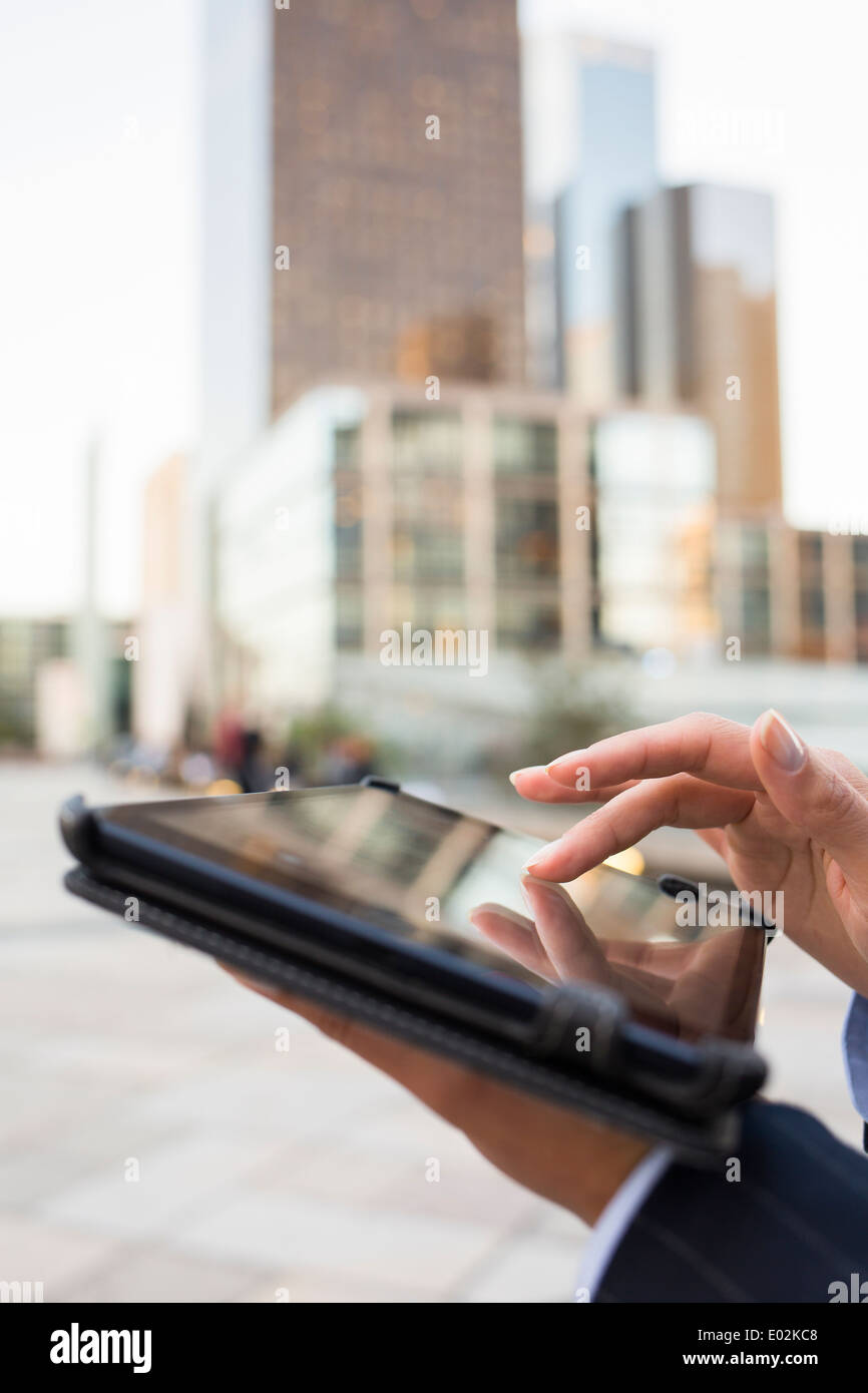 Female Tablet PC hand outdoor Building Stock Photo