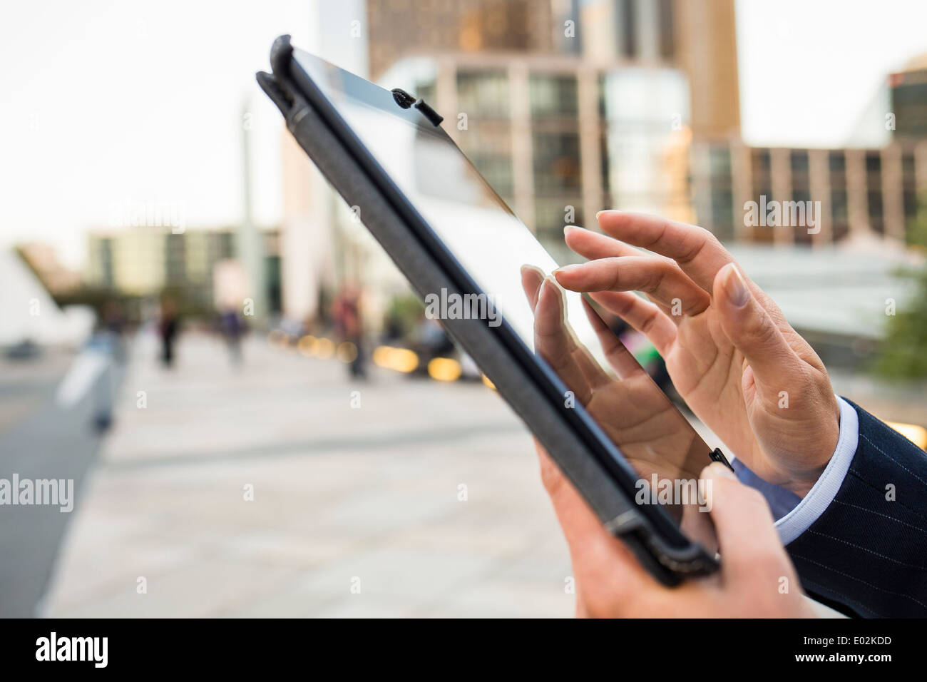 Female Digital Tablet hand outdoor Building Stock Photo