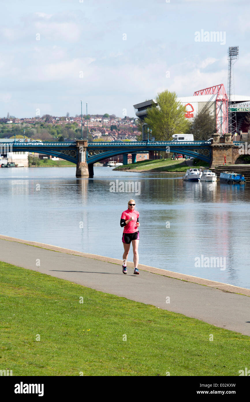 A jogger running along the Embankment next to the River Trent in Nottingham. Stock Photo