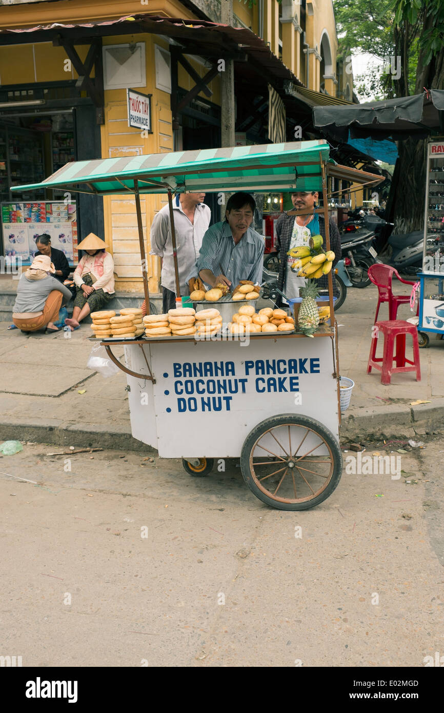 Fast Food Street Stall selling Pancakes Donuts in the Old Town Hoi An Vietnam Stock Photo