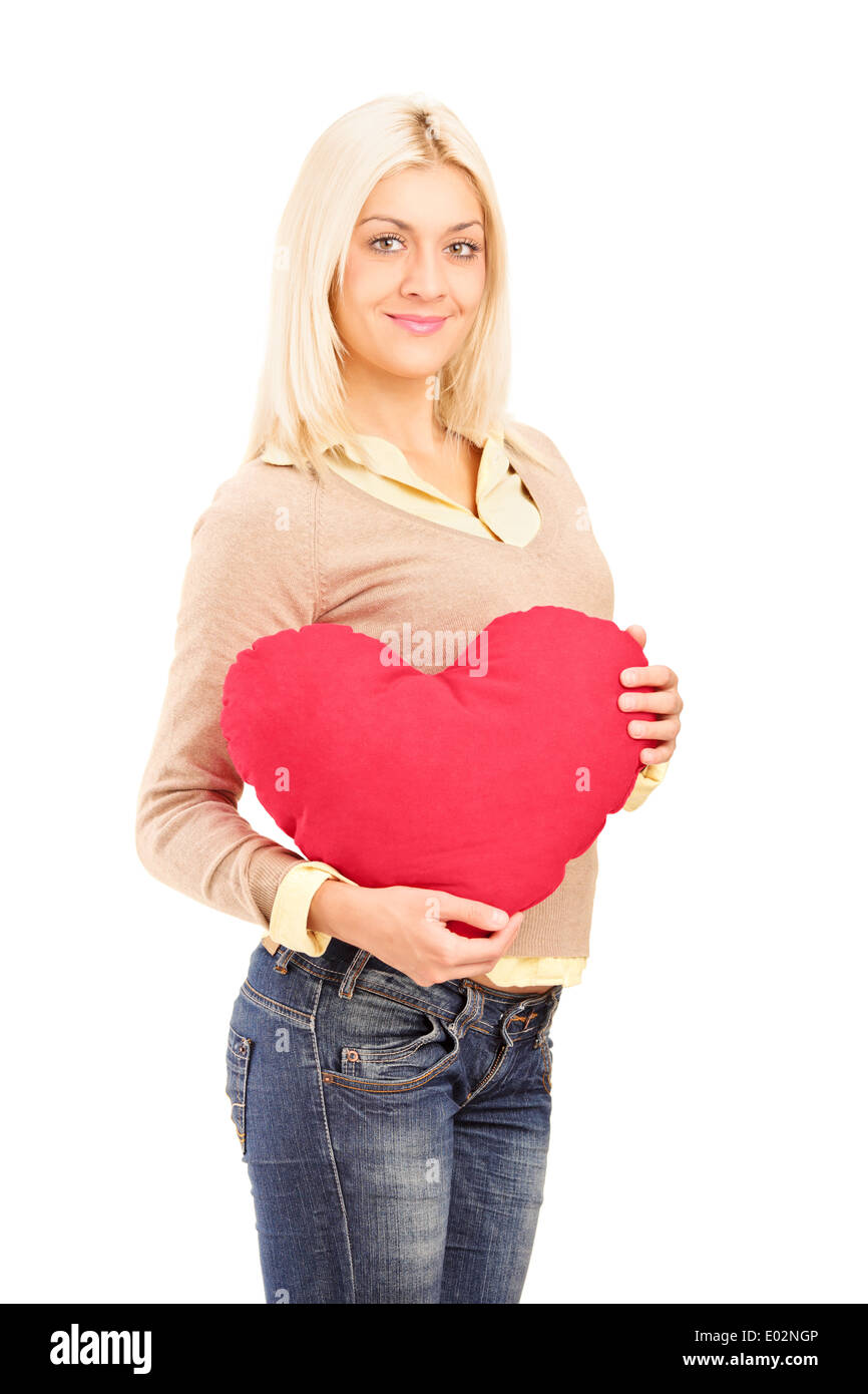 Young Woman Sitting In Bed With Heart Shaped Cushion High-Res Stock Photo -  Getty Images