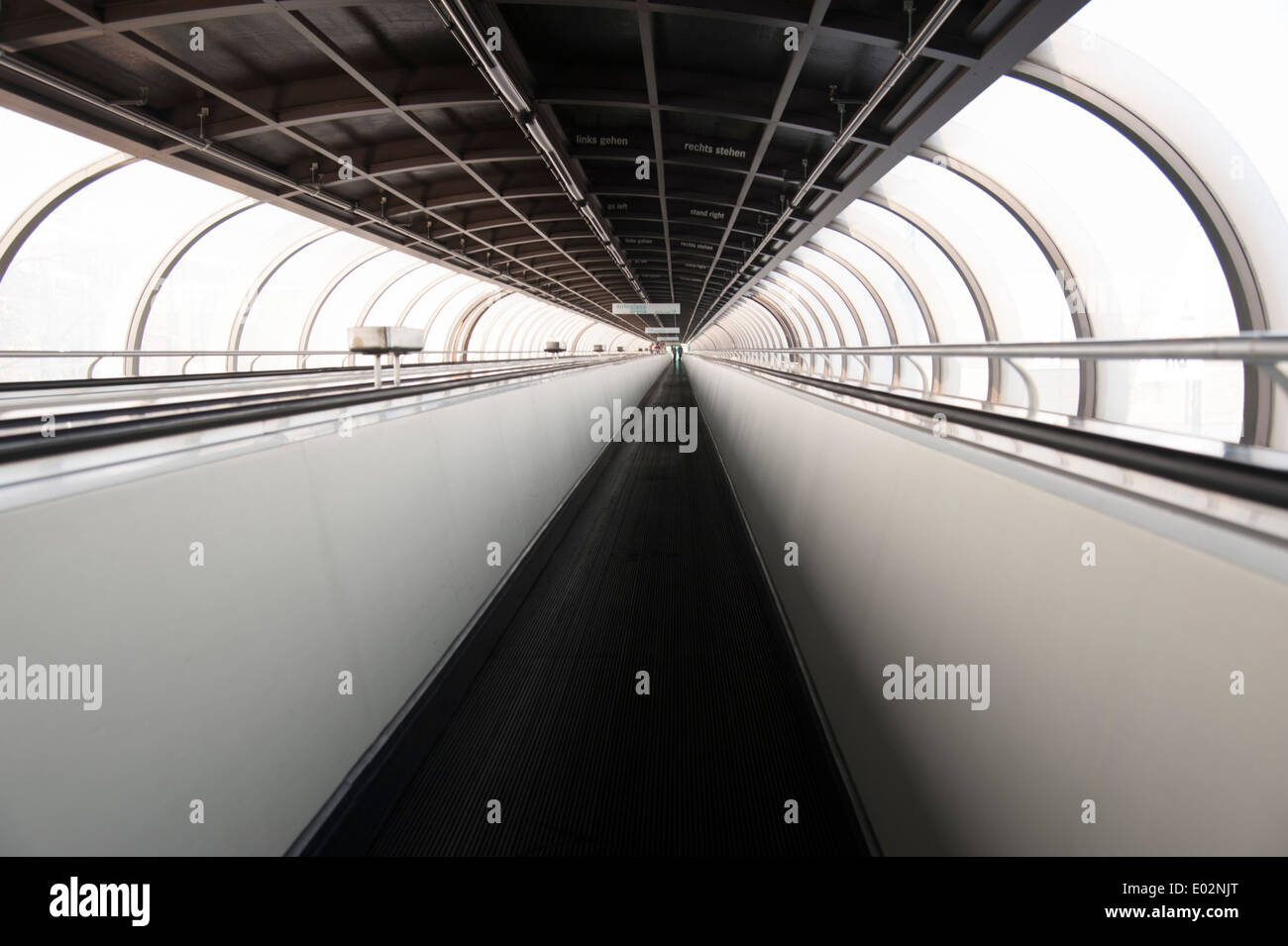 moving sidewalk in oval tunnel connecting exhibition halls on Fair Ground Düsseldorf, Germany Stock Photo