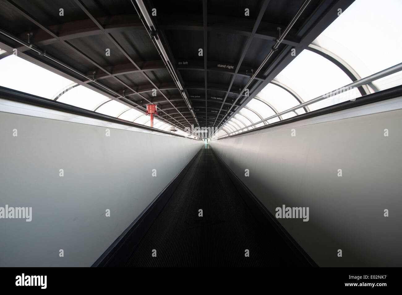 moving sidewalk in oval tunnel connecting exhibition halls on Fair Ground Düsseldorf, Germany Stock Photo