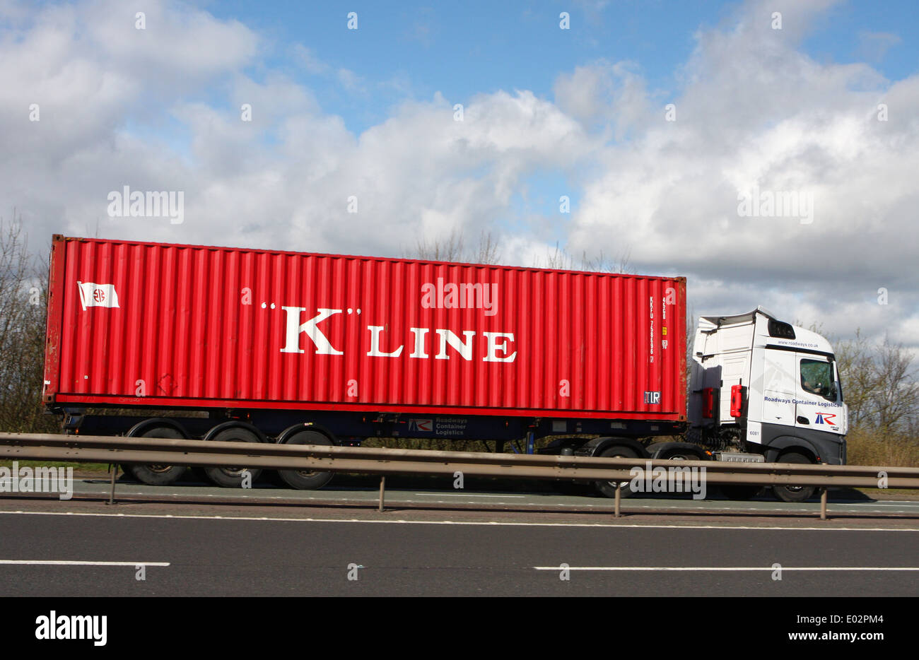 A K Line shipping container being hauled along the A46 dual carriageway