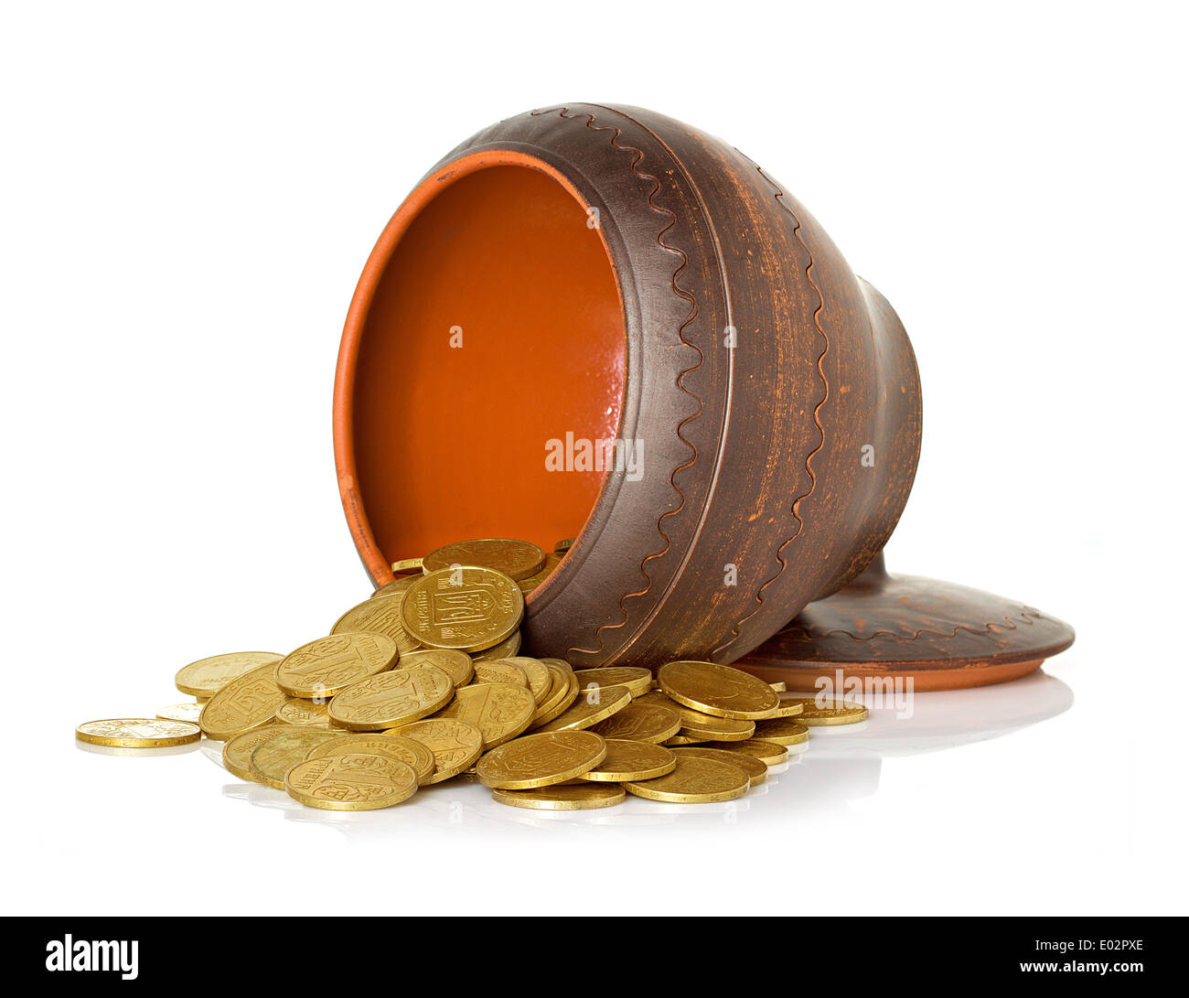 ceramic pot full of coins close-up isolated on white background Stock Photo
